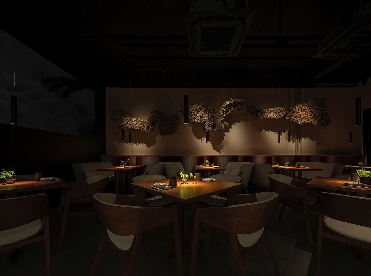 A well-designed industrial-style restaurant interior with modern furniture and minimalist decor.