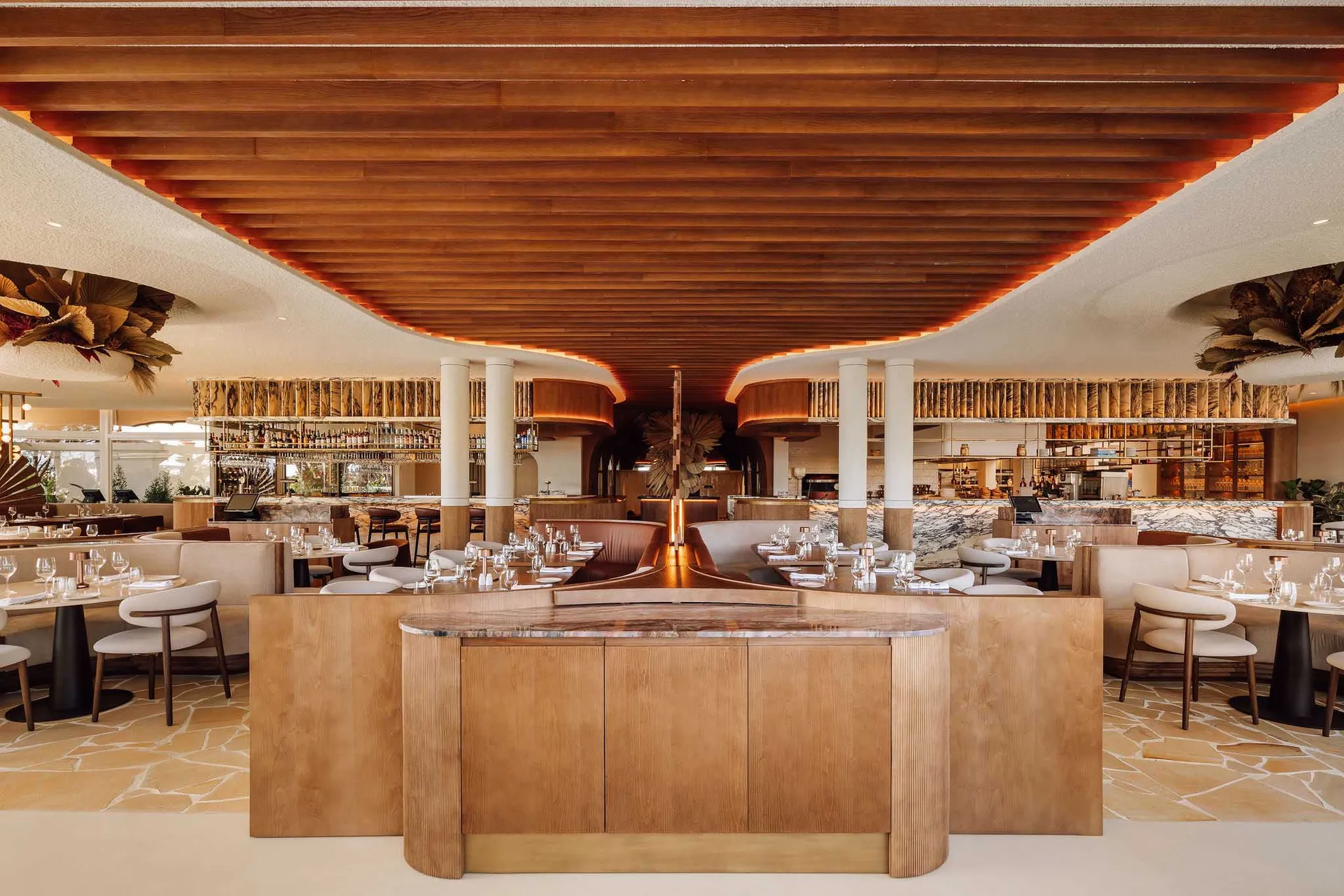 A modern restaurant bar with wooden decor and seating.
