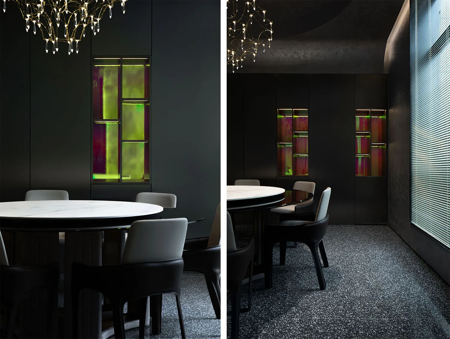 A modern dining room featuring a marble table and chairs, with a glass cabinet displaying colorful artworks.