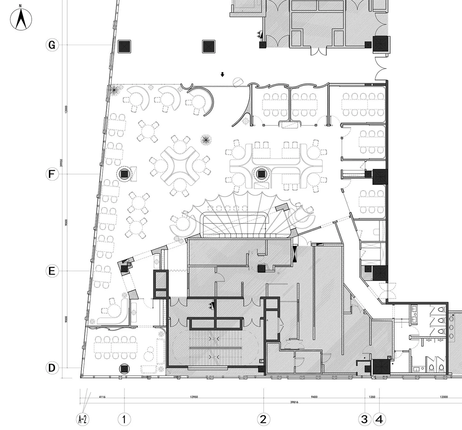 Floor plan of a modern office with desks arranged in various layouts.