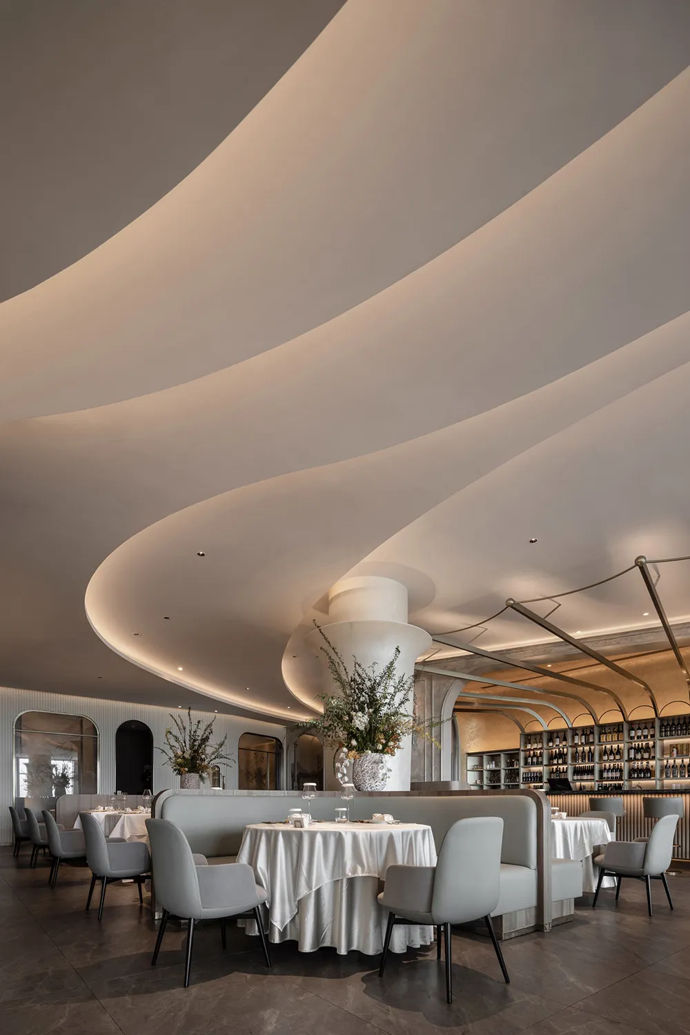 Contemporary restaurant interior with concrete walls and plaster finishes