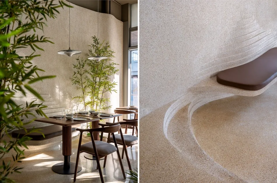 Modern restaurant interior with concrete flooring and seating