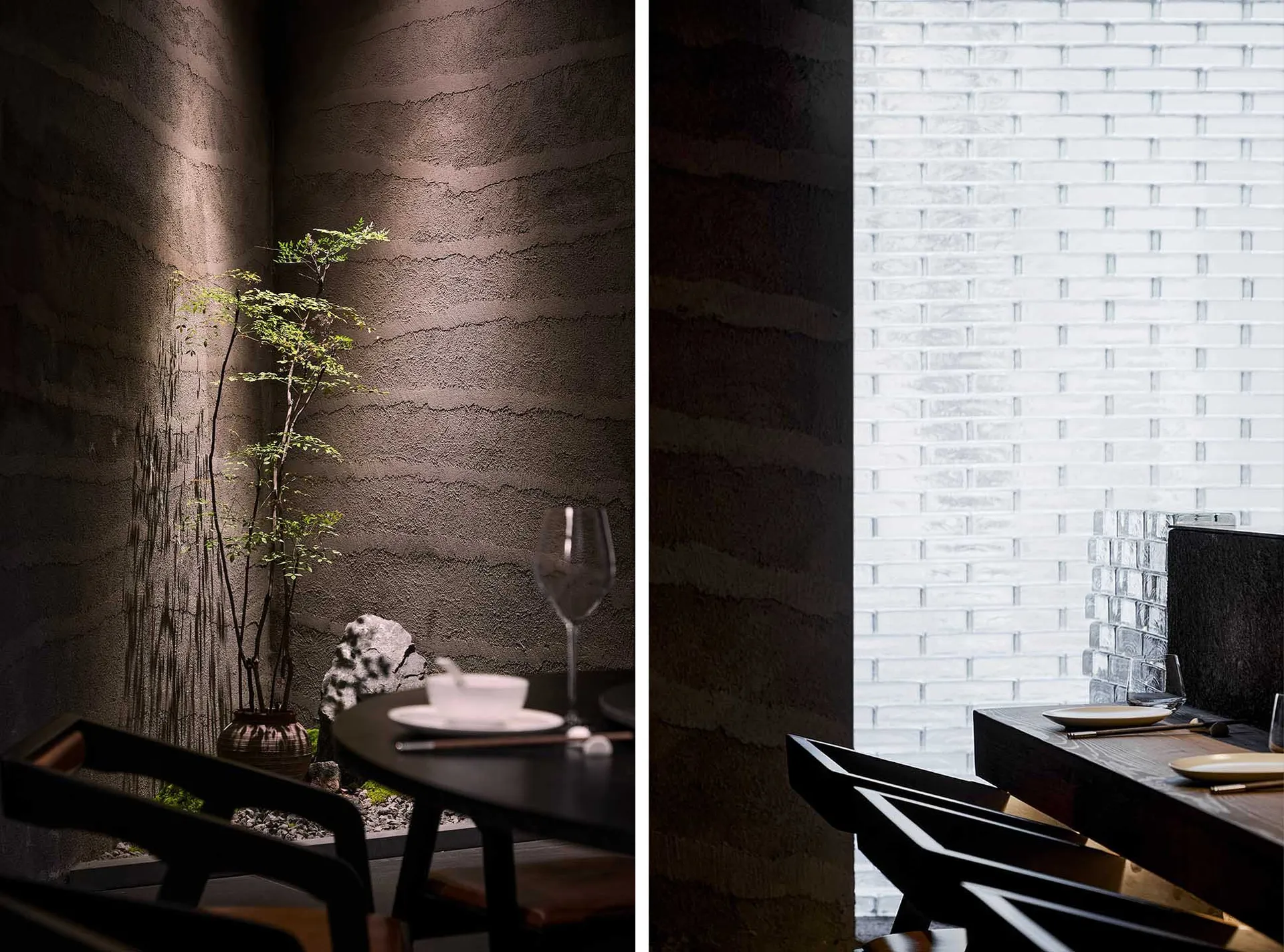 A serene restaurant interior featuring a textured concrete wall and minimalist dining setup.