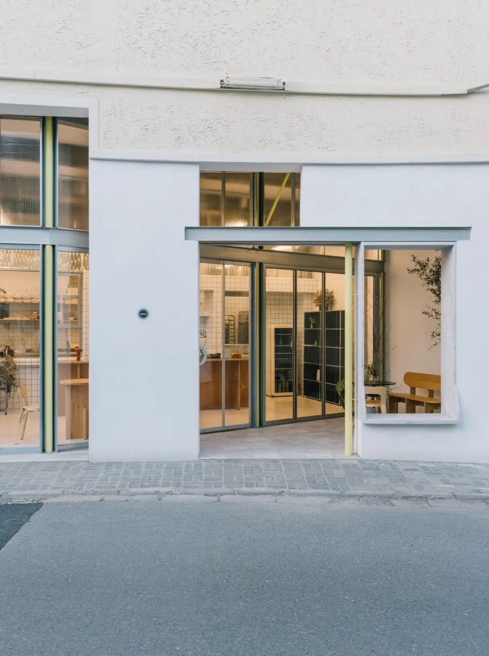A modern retail storefront with large glass windows and a sleek, minimalist design.