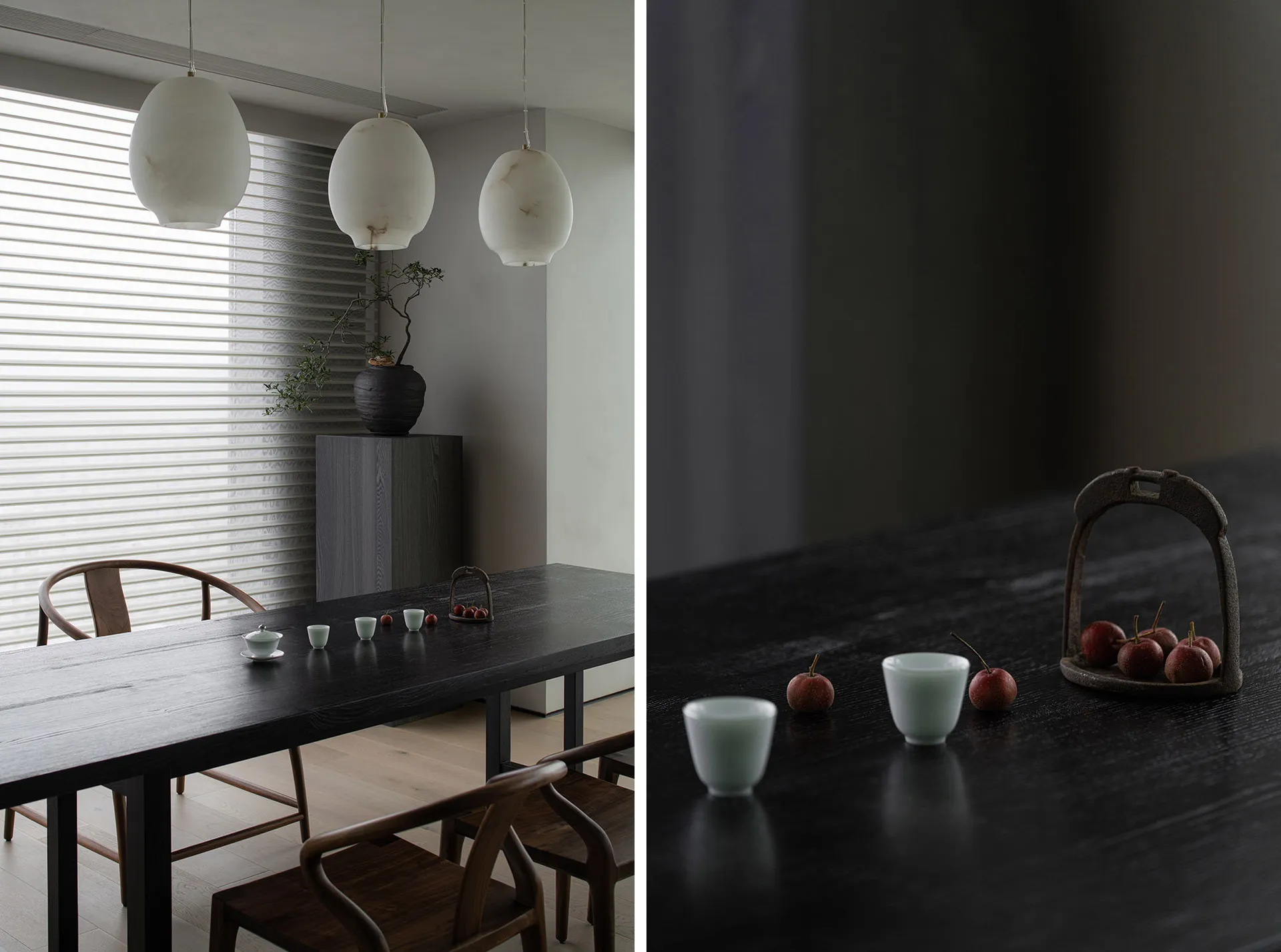 A modern dining room with black wooden furniture and minimalist decor.