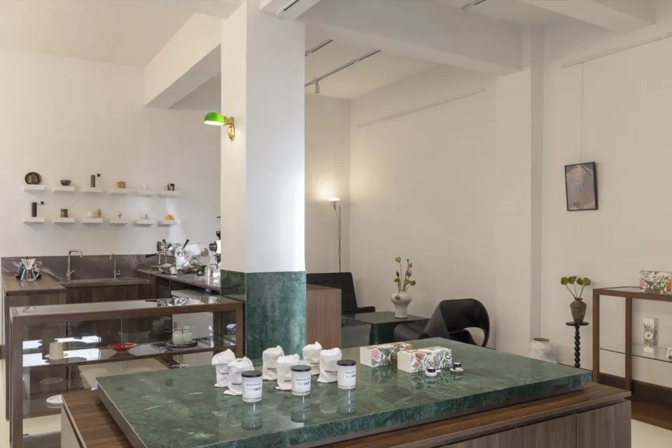Interior design image featuring a modern retail storefront with a marble countertop.
