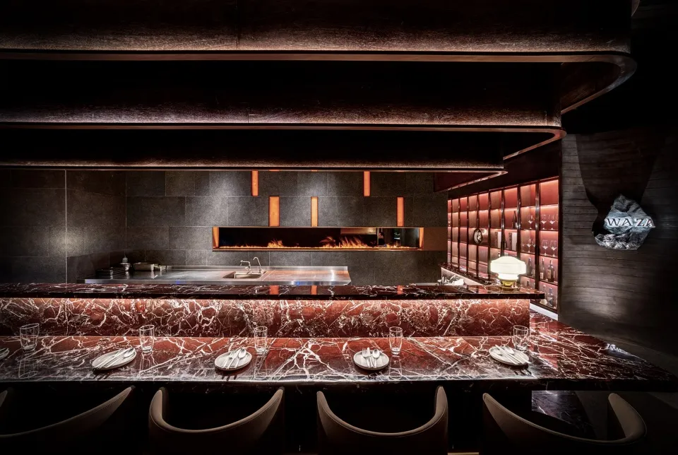 A sleek, modern restaurant interior with a luxurious marble countertop.