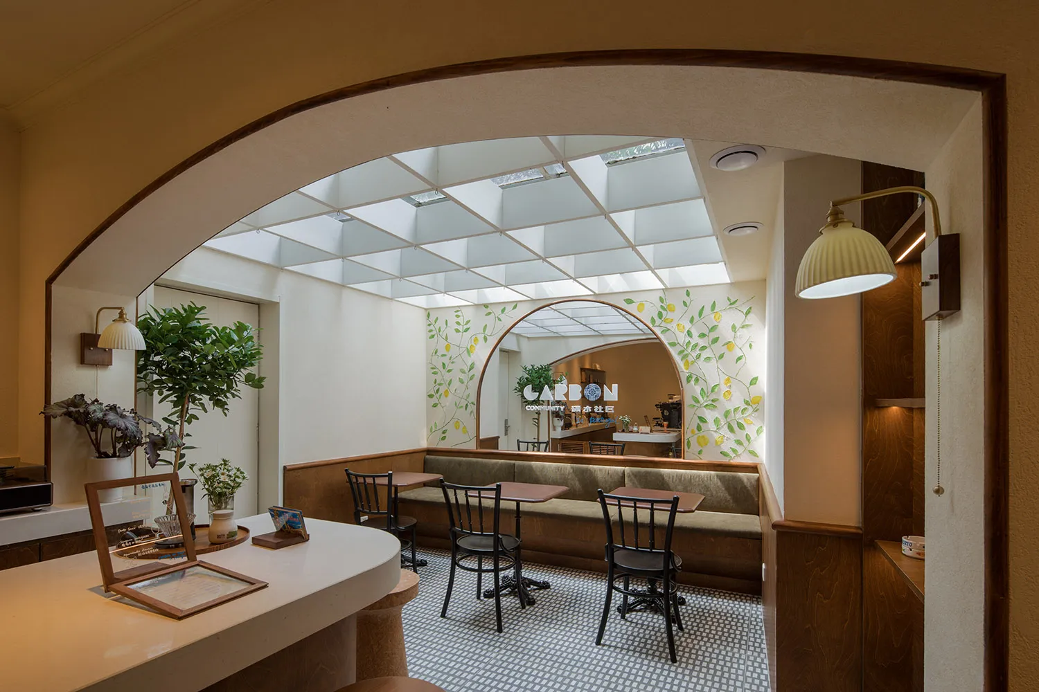 A cozy cafe with wooden furniture and concrete and glass accents