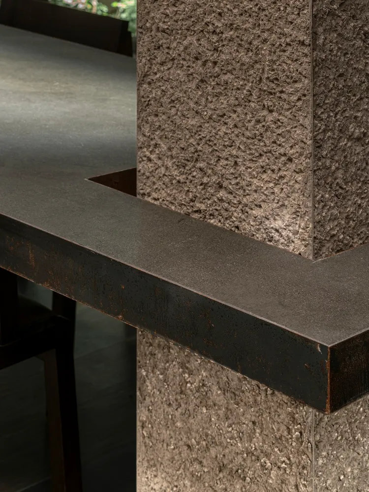 Modern minimalist interior design featuring concrete elements.