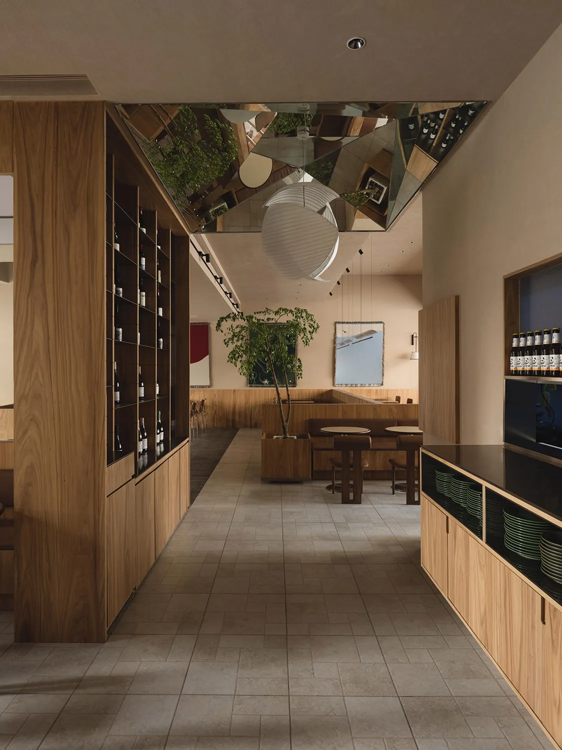 Modern restaurant interior design featuring wooden shelving, concrete flooring, and contemporary furniture.