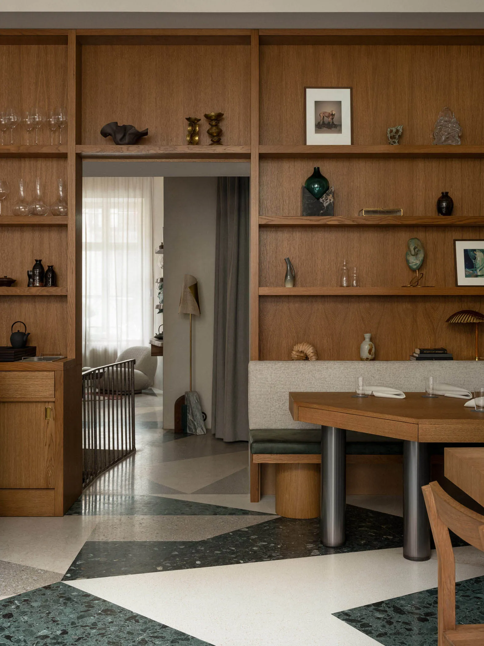 Modern residential dining room featuring wood and marble materials.