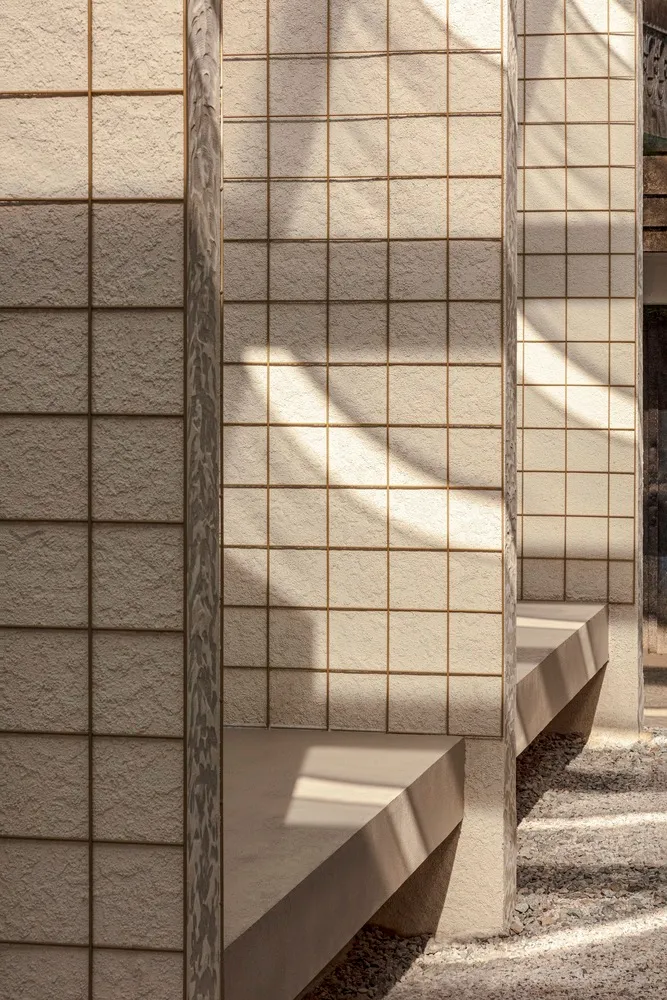 Concrete wall and bench with shadows