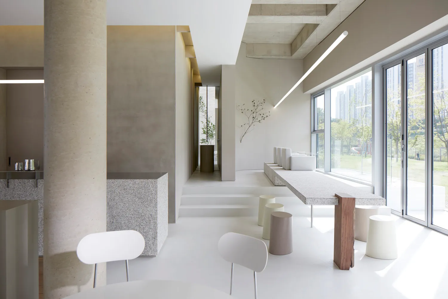 Modern commercial interior design featuring minimalist concrete elements.