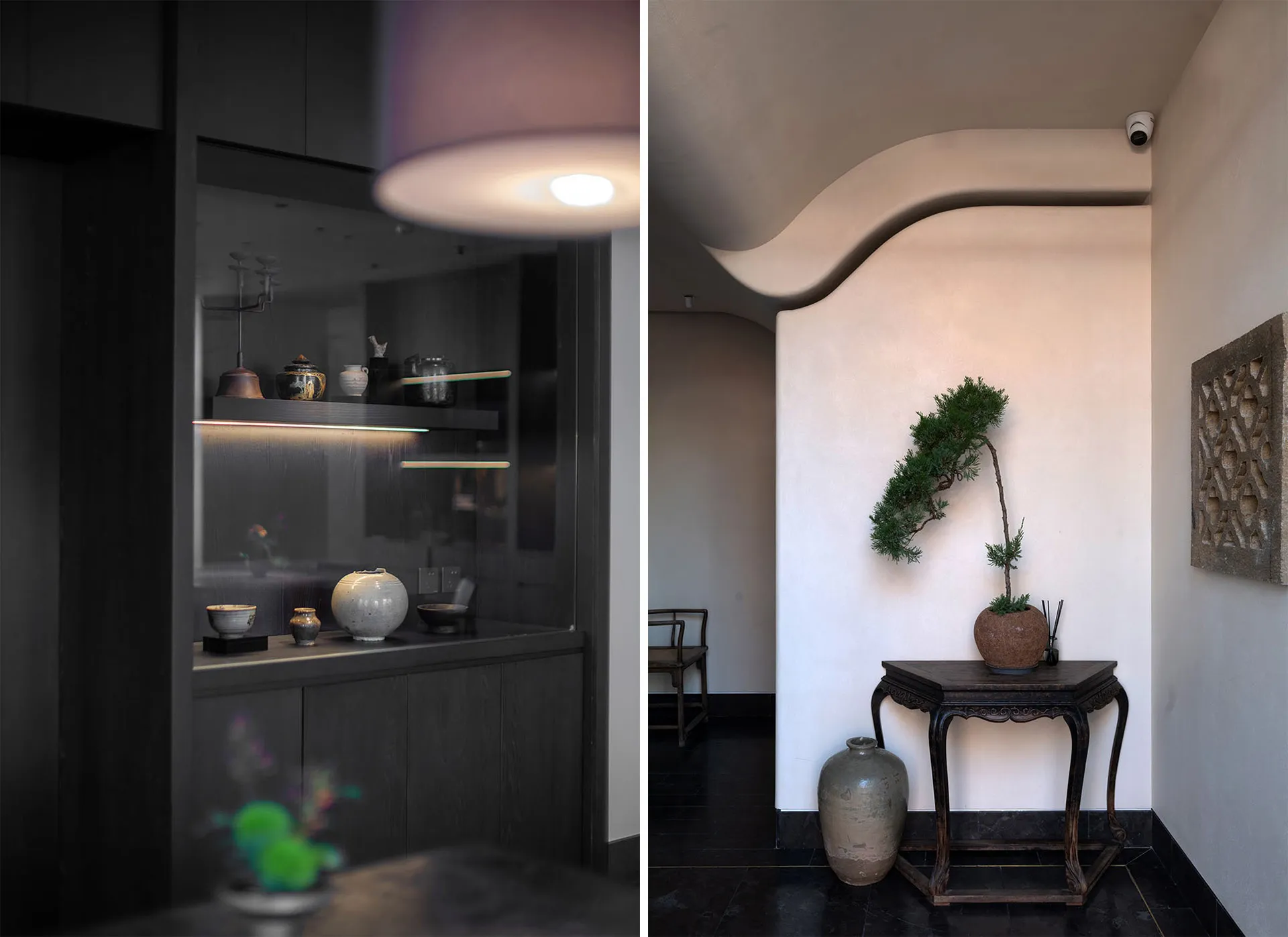 Modern living room with wooden furniture, concrete walls, and glass shelving displaying decorative items.
