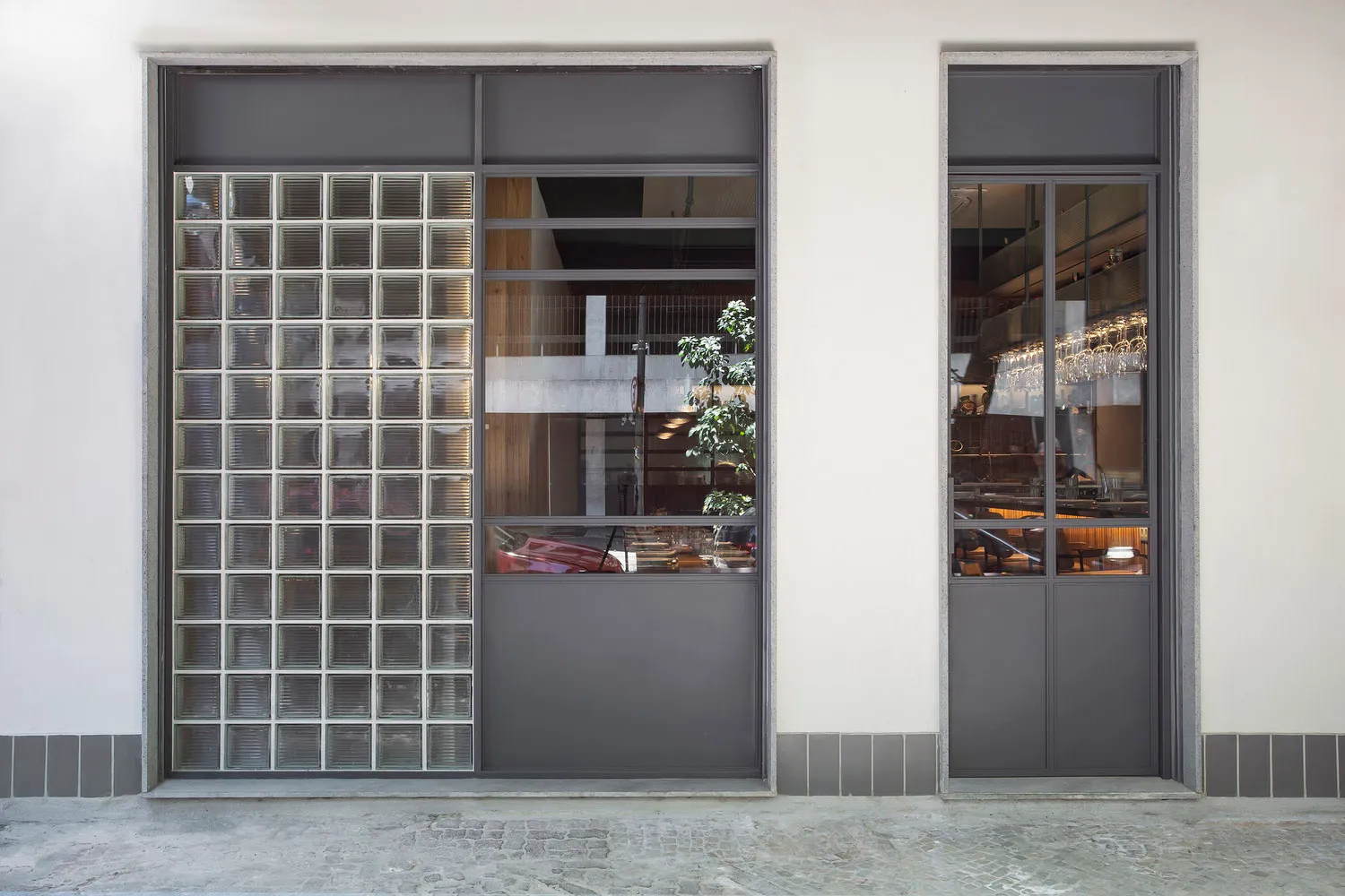The storefront features a modern glass design.