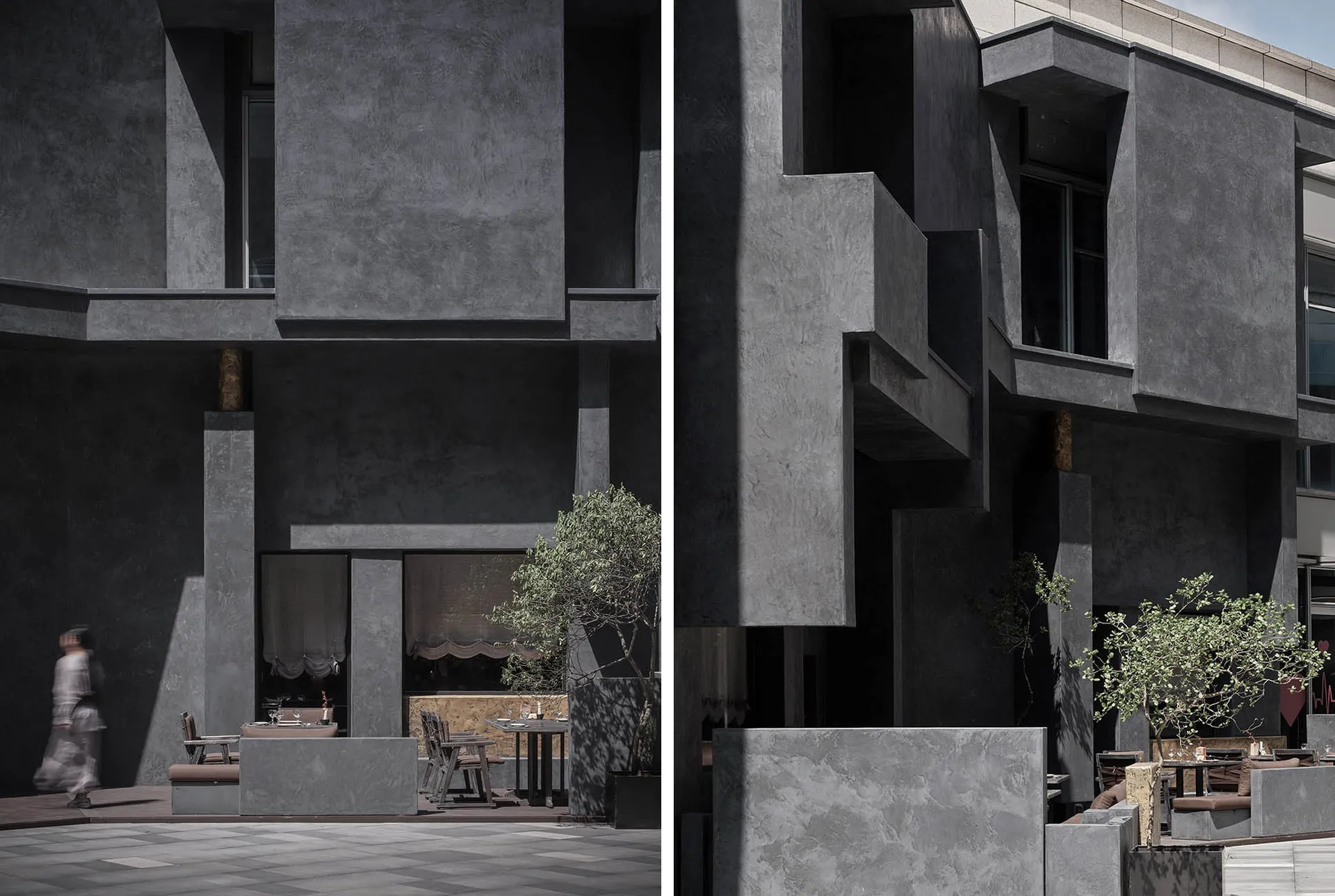 Concrete restaurant exterior with outdoor seating and greenery.