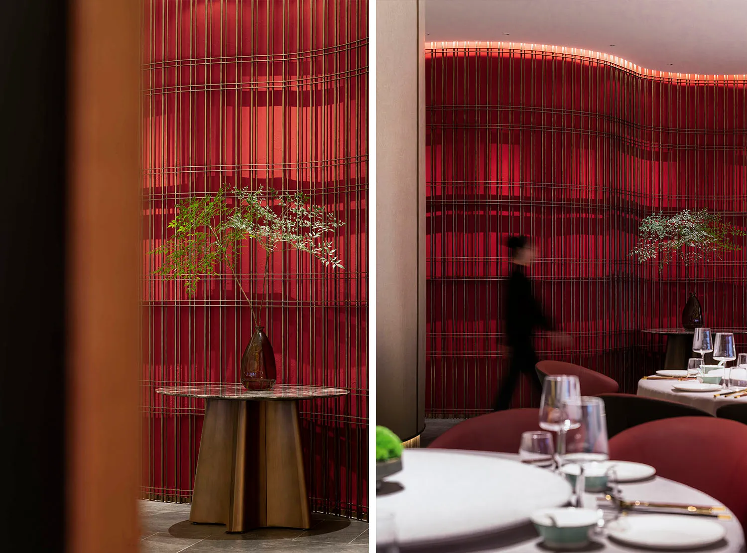A modern restaurant interior featuring red acrylic walls and a curved design.