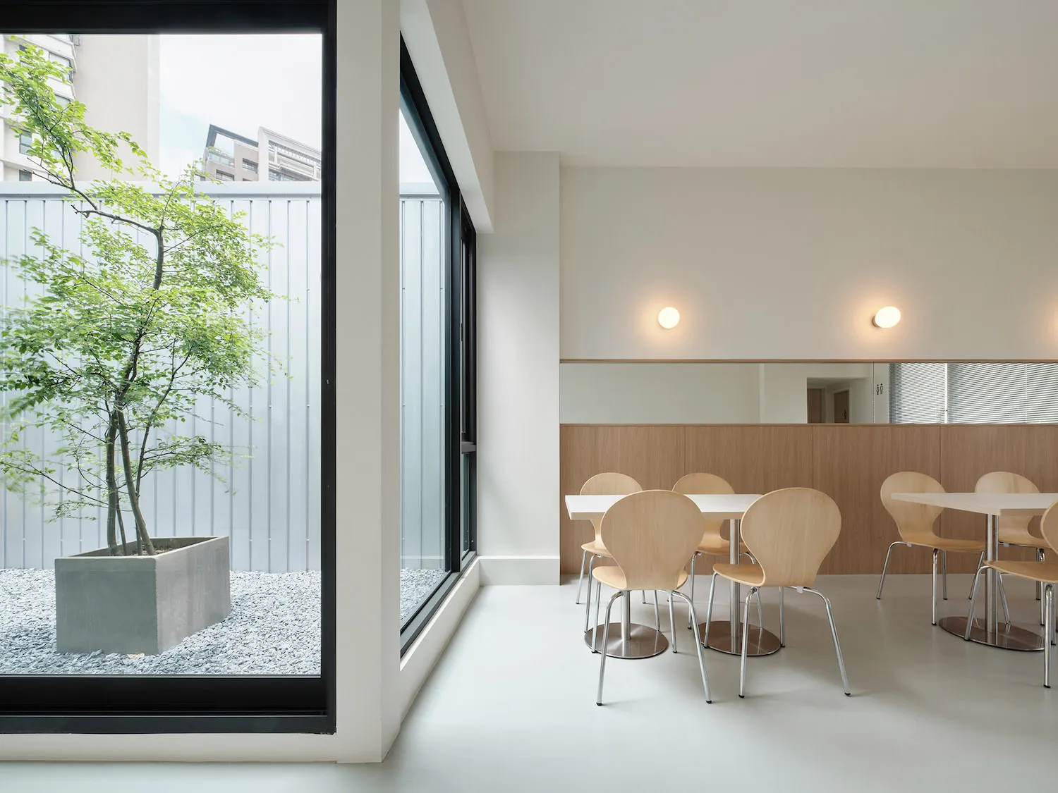Modern minimalist cafe interior with wooden, steel, and concrete elements