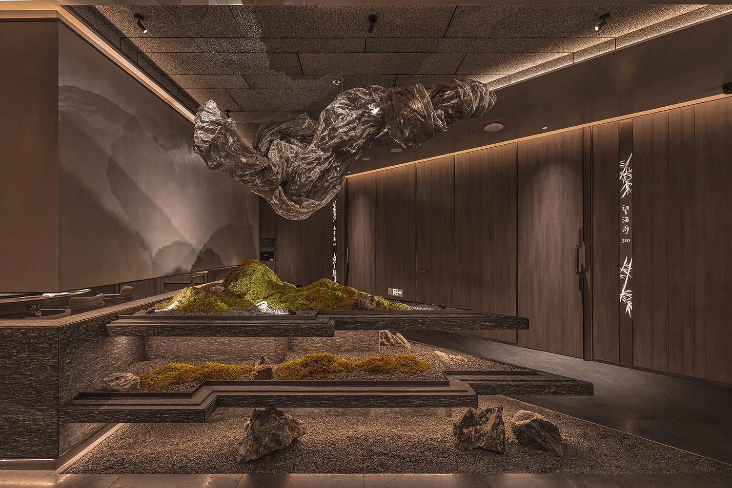 Contemporary spa interior with metallic lighting fixtures and metallic sculpture.