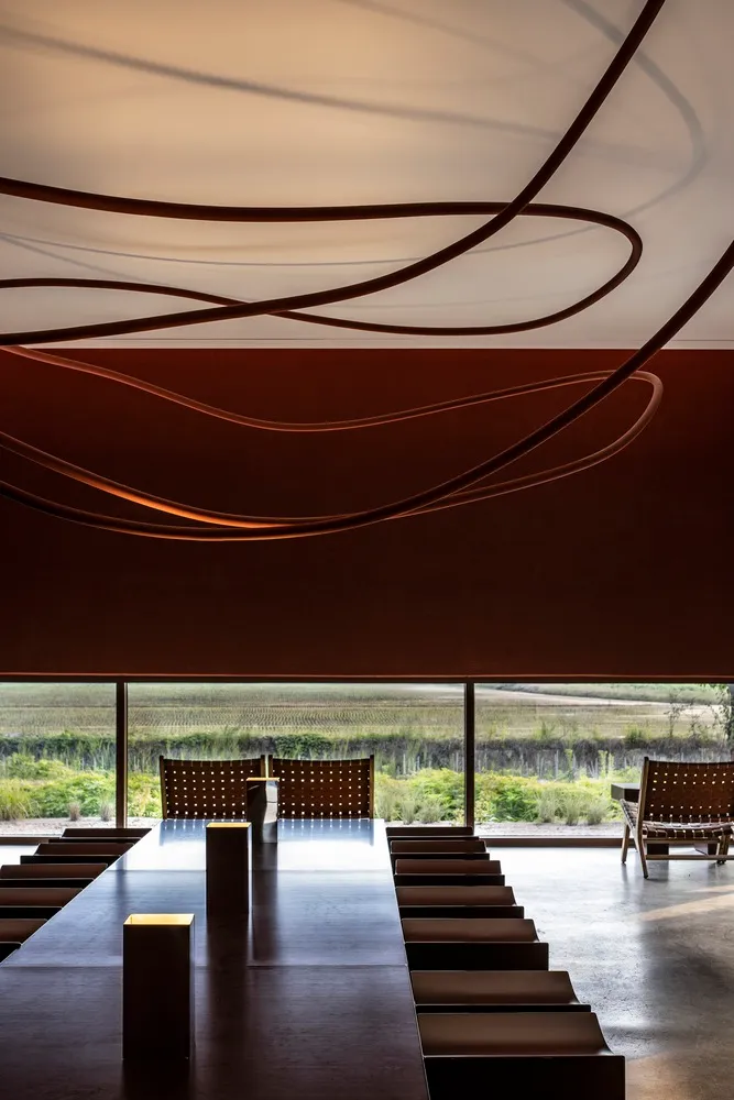 Modern restaurant dining room featuring sleek metallic design elements