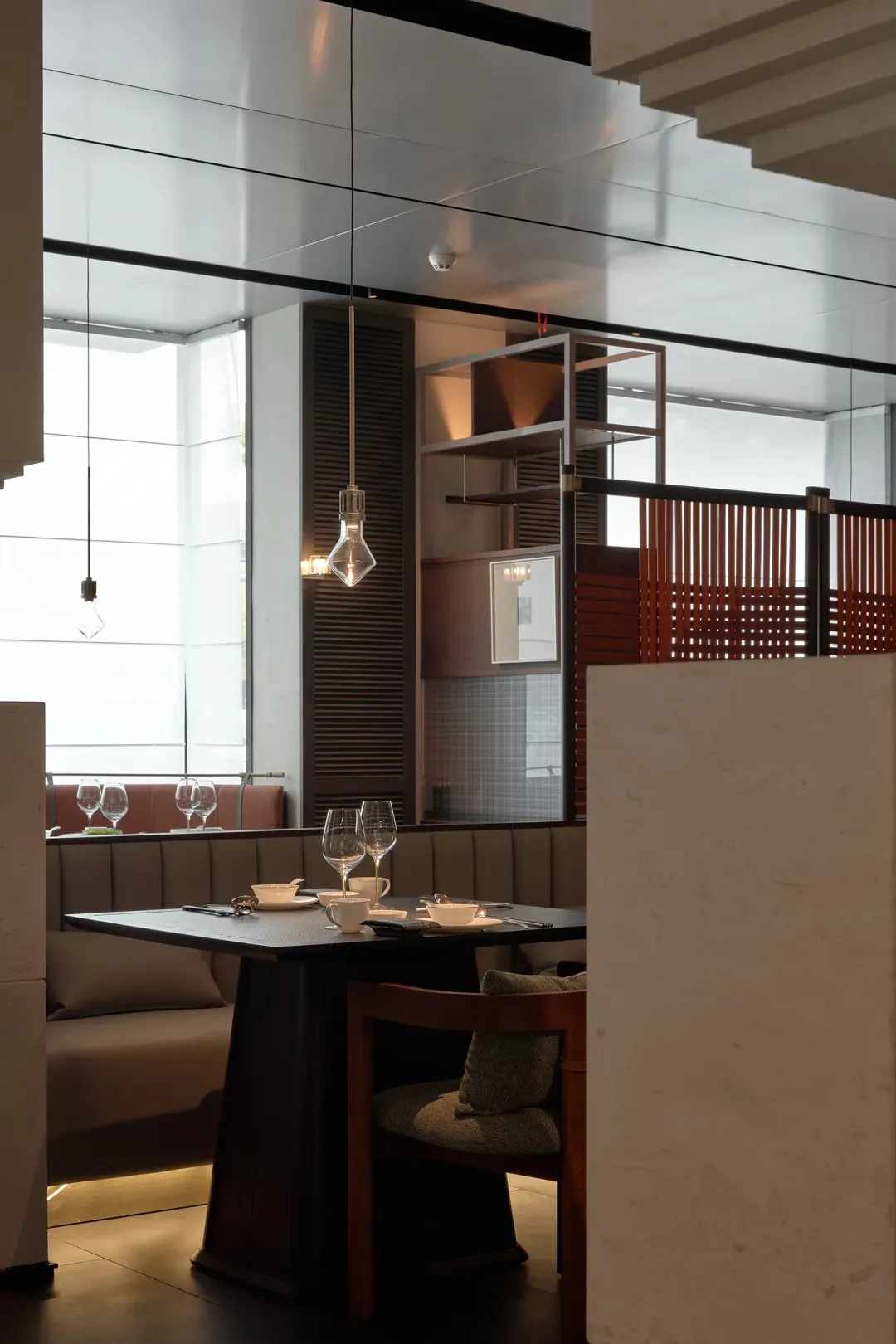 A modern dining room interior with contemporary furniture and minimalist decor.