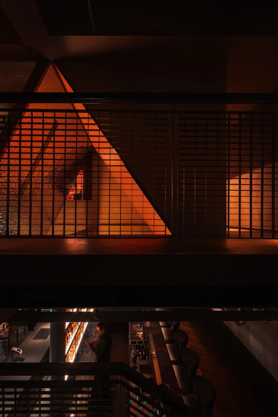 A modern cafe interior with a metal grid structure
