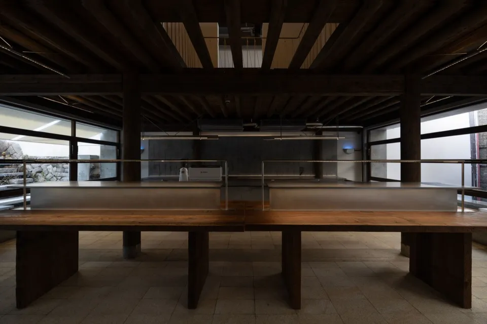 Industrial-style office space with metal, steel, and concrete materials.