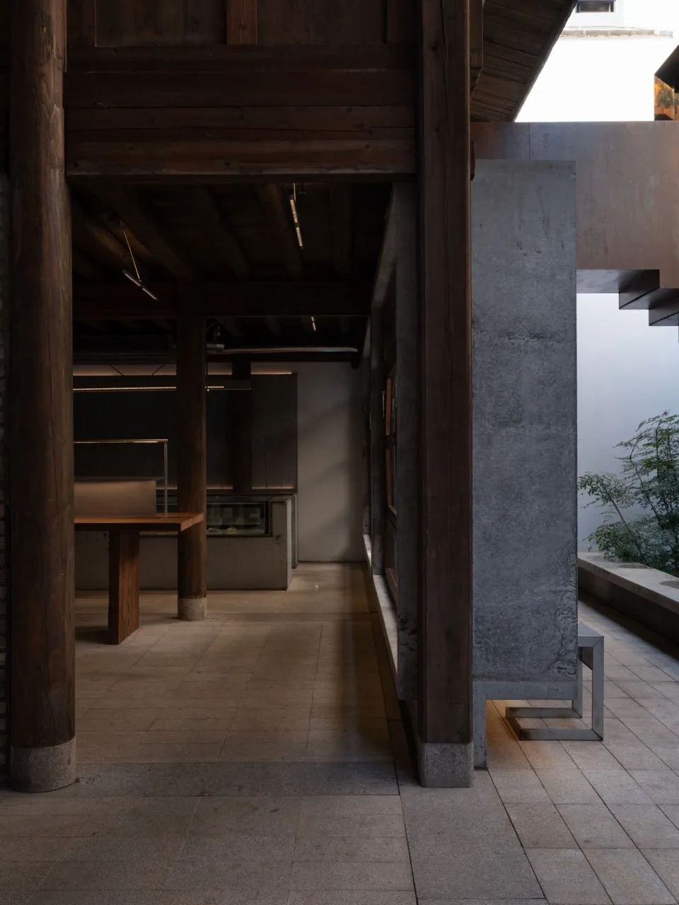 Industrial-style interior space featuring concrete and wooden elements.