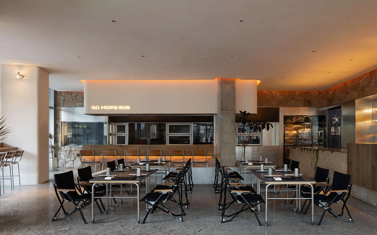 Modern restaurant interior with concrete walls and contemporary design elements