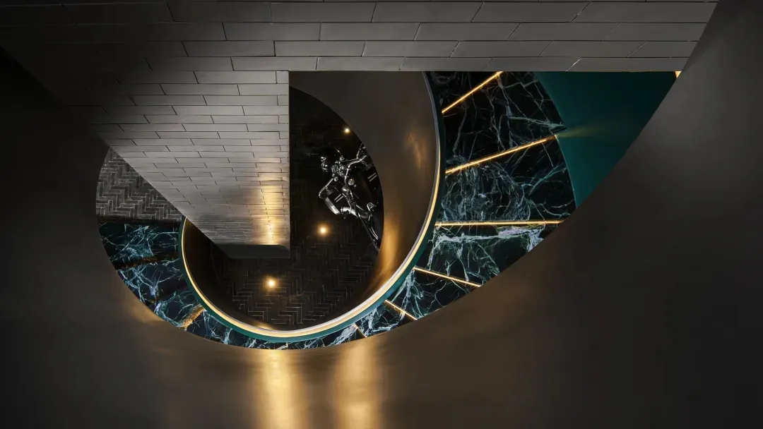 A modern interior featuring marble and stainless steel materials