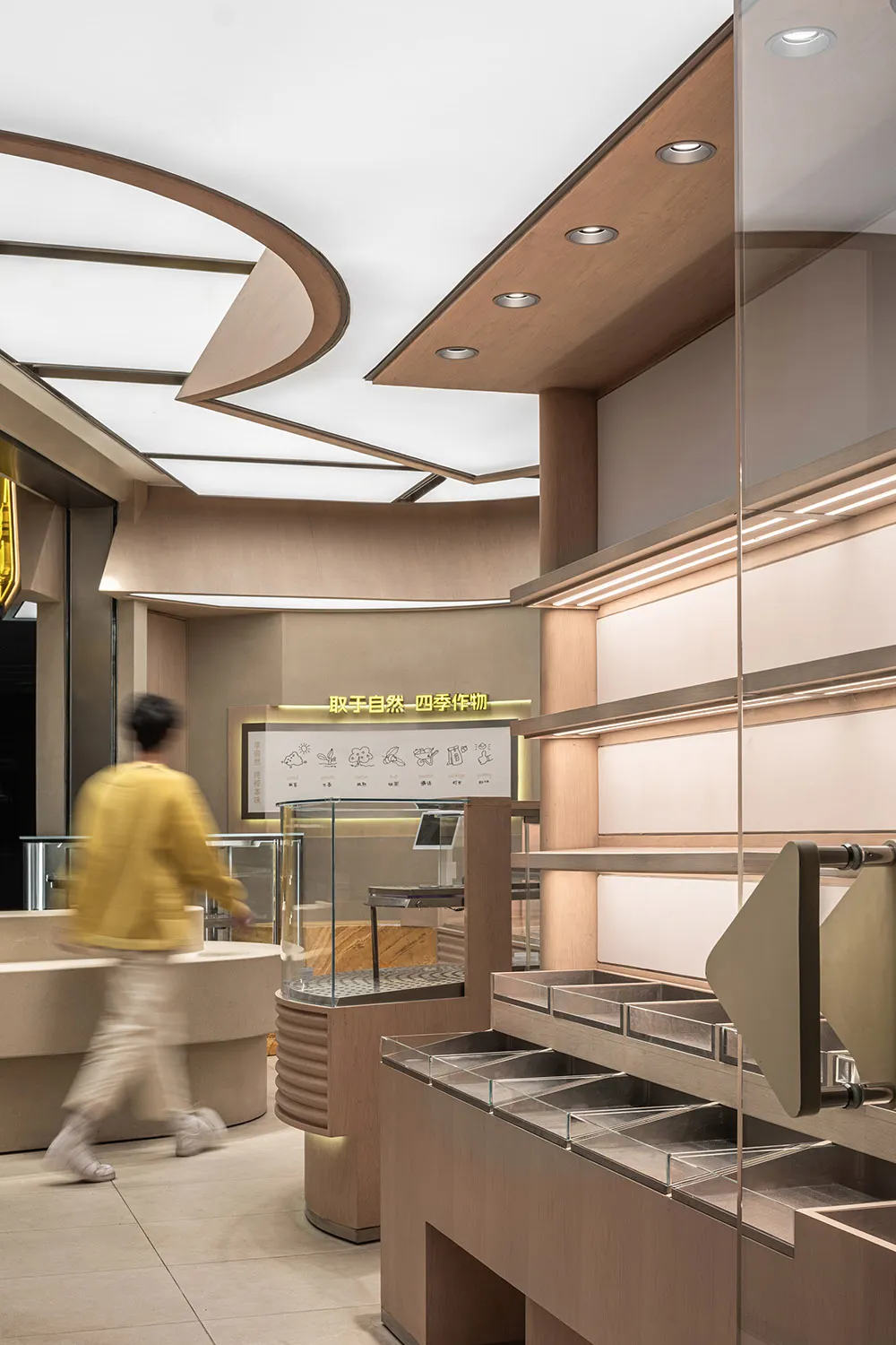 A modern retail store featuring wooden, glass, and metallic materials.
