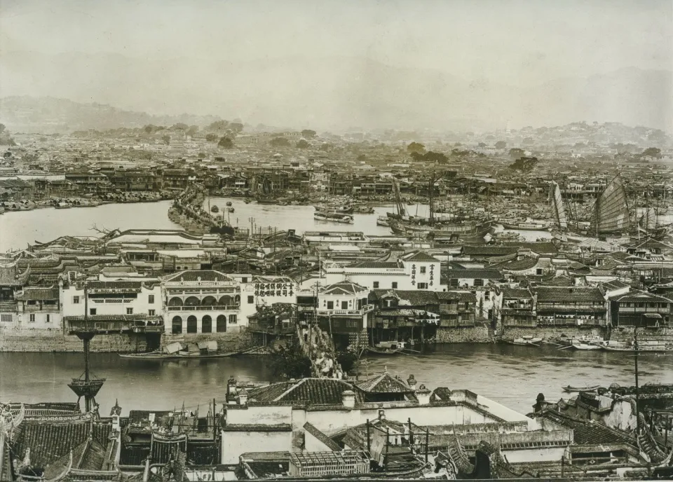 Historical water town with traditional Chinese architecture and numerous boats on the water