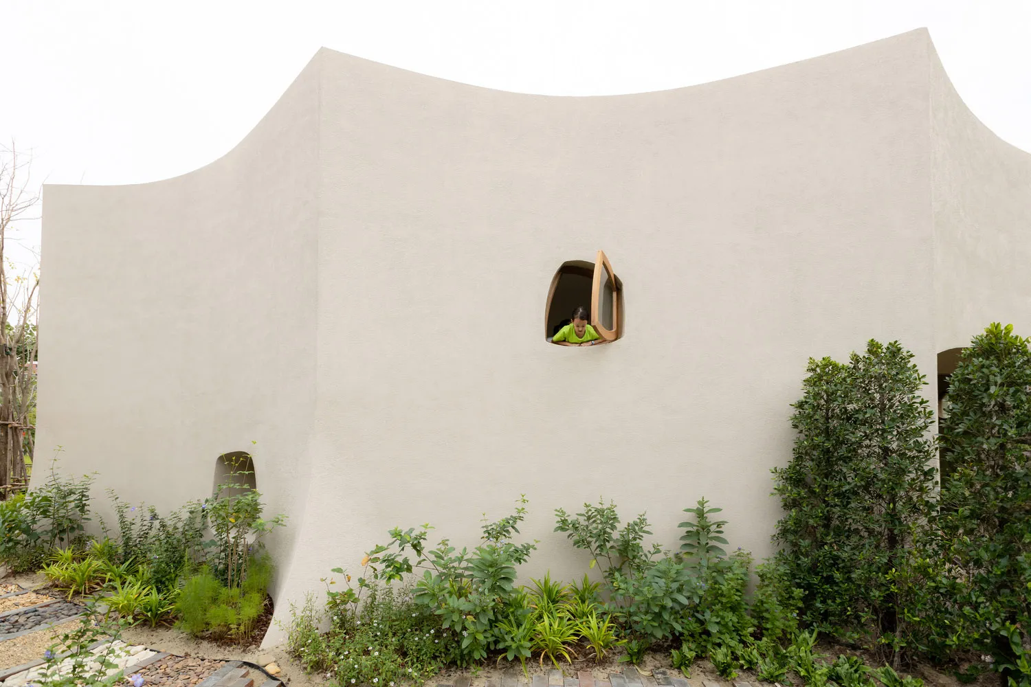 A minimalist building made of sandstone