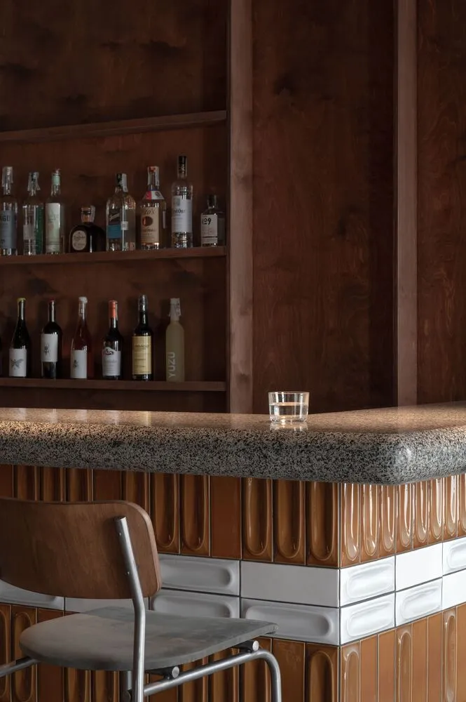 Industrial-style bar counter made of marble with a textured surface.