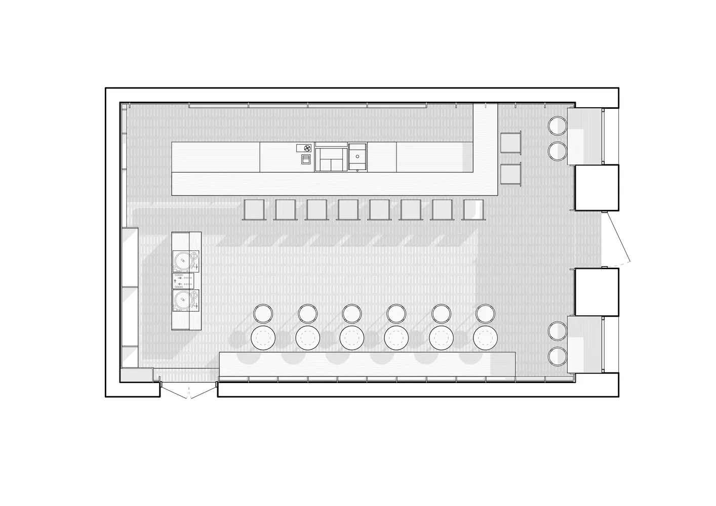 A floor plan of a coffee shop with seating areas, a counter, and a kitchen area.