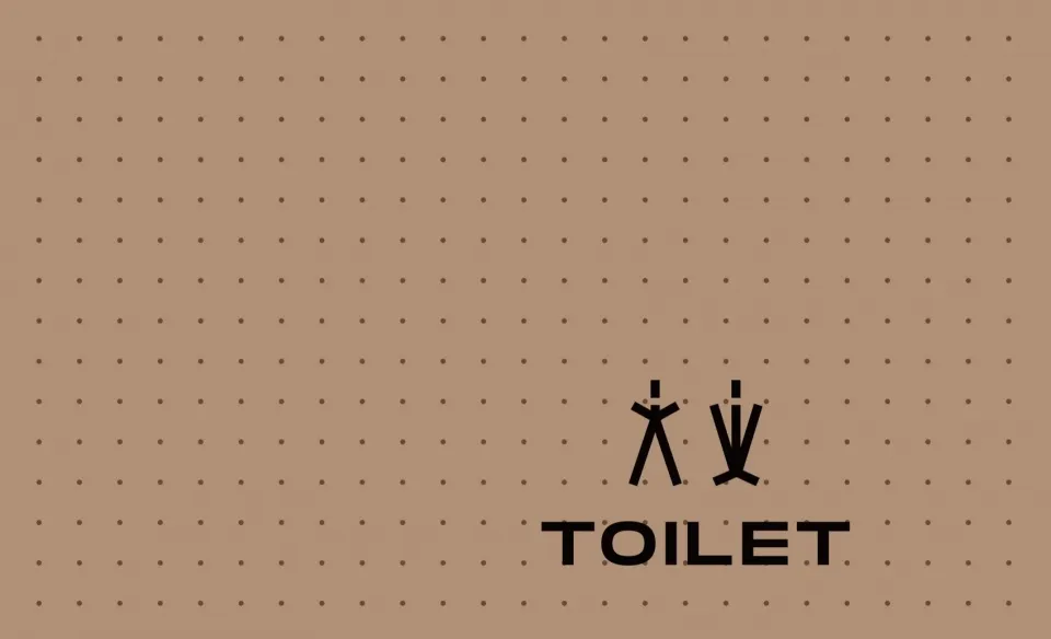Minimalist illustration of a toilet symbol, featuring two stylized human figures adjacent to a bathroom icon on a dotted back