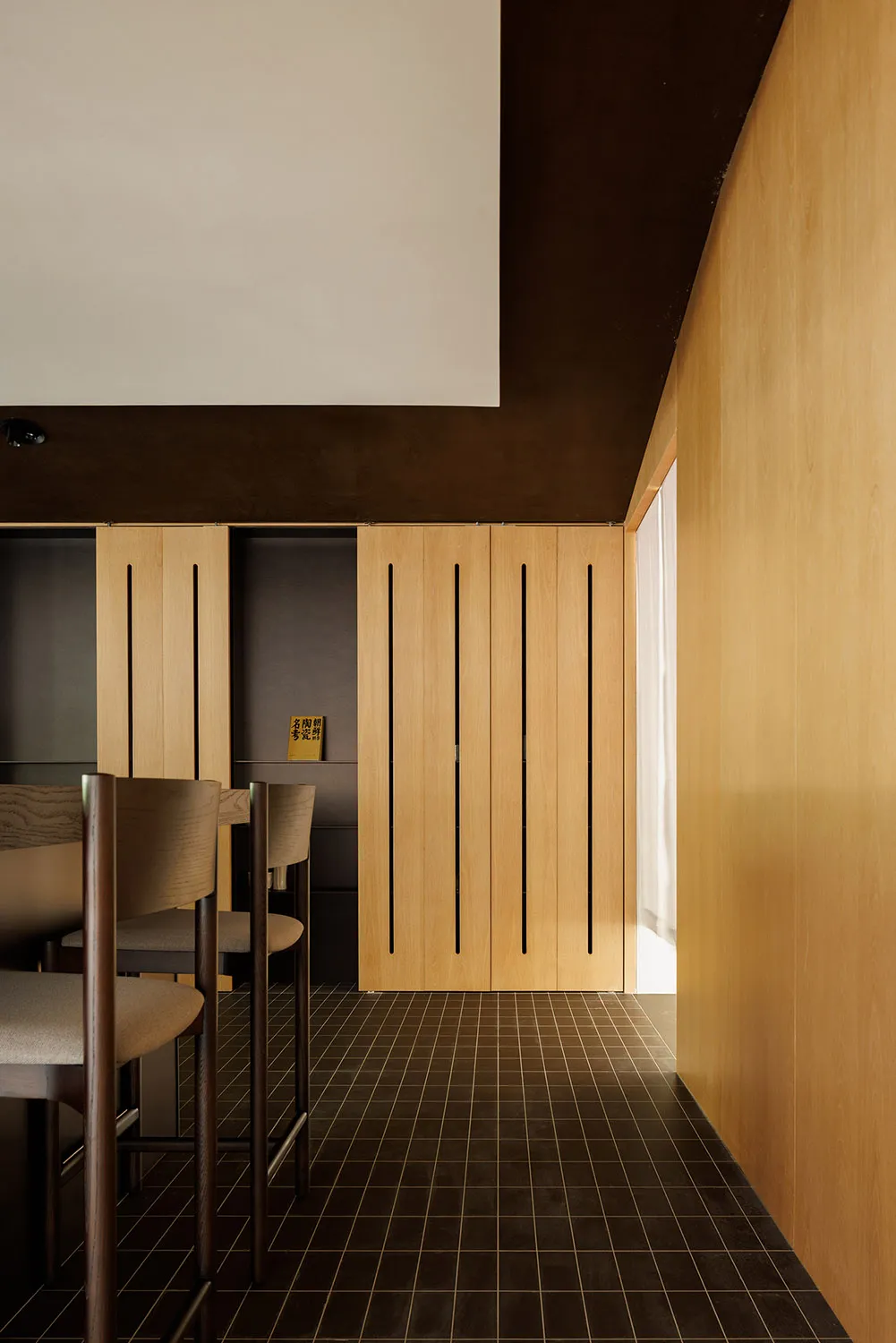 Modern residential space featuring wooden elements and minimalist design.