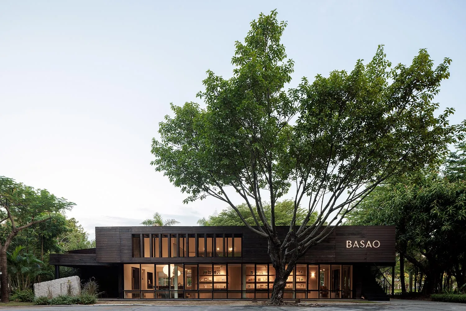 Modern retail storefront with metallic, glass, and concrete materials