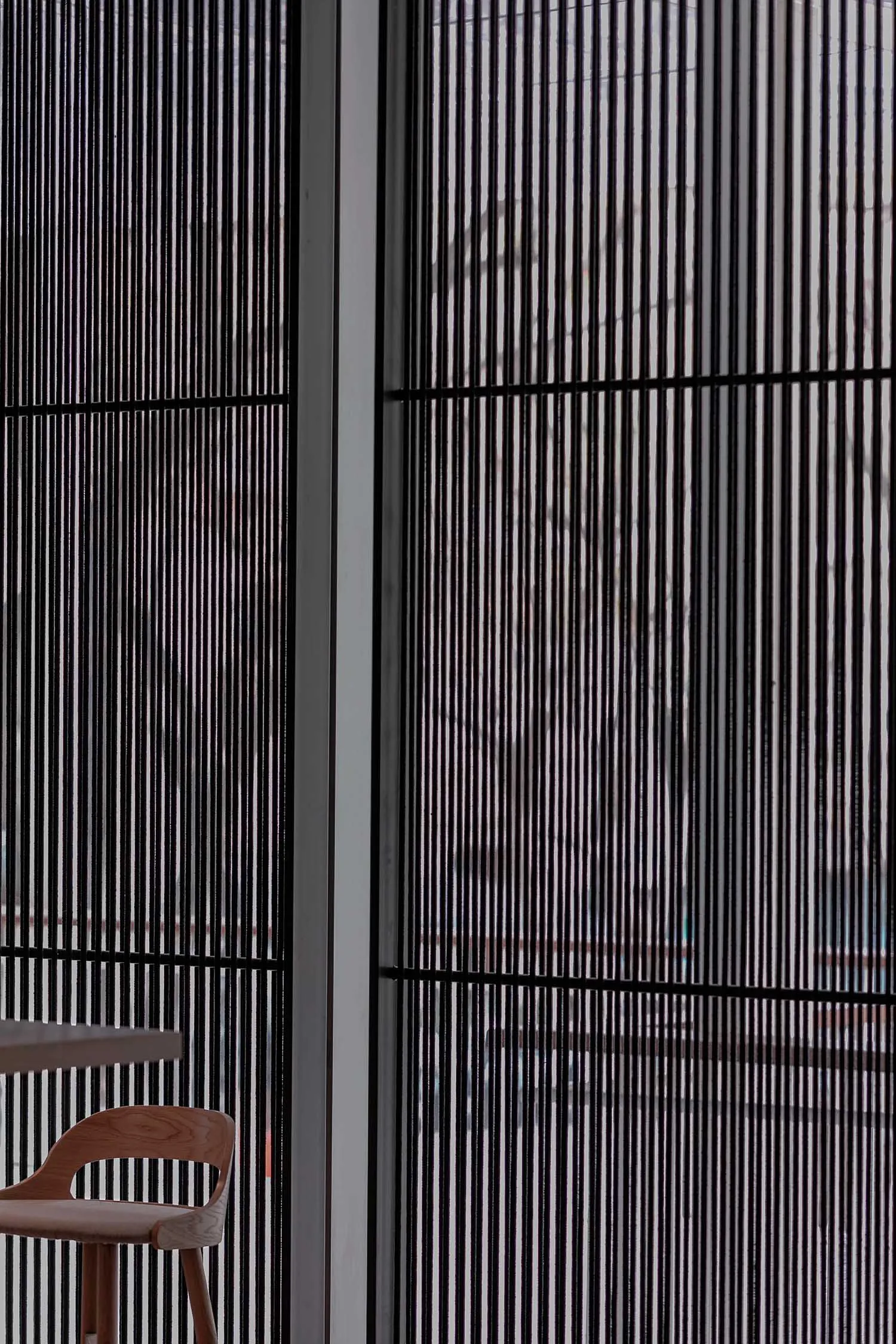 Modern interior design featuring metallic window blinds
