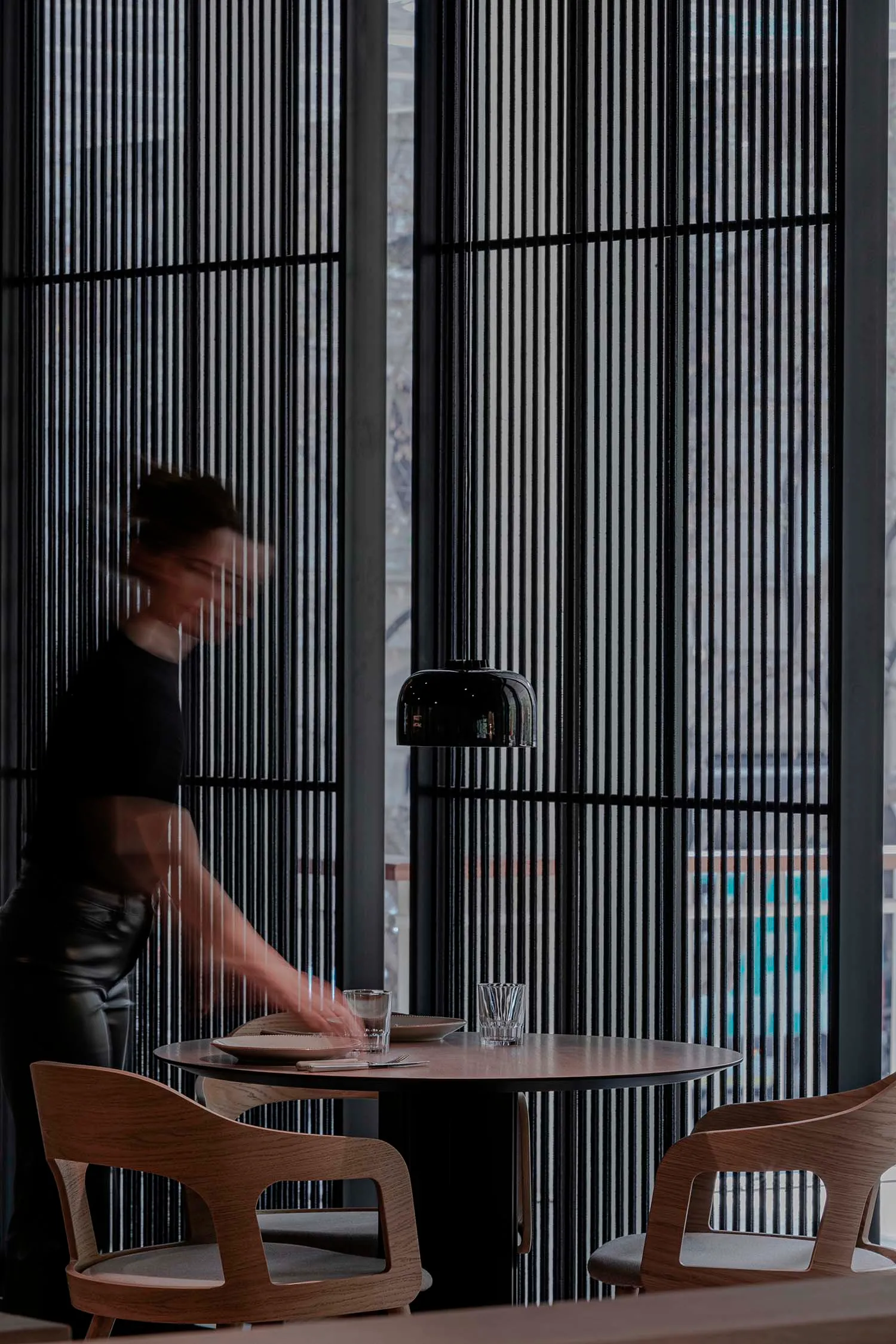 A modern, well-lit restaurant setting with contemporary furniture and lighting fixtures.