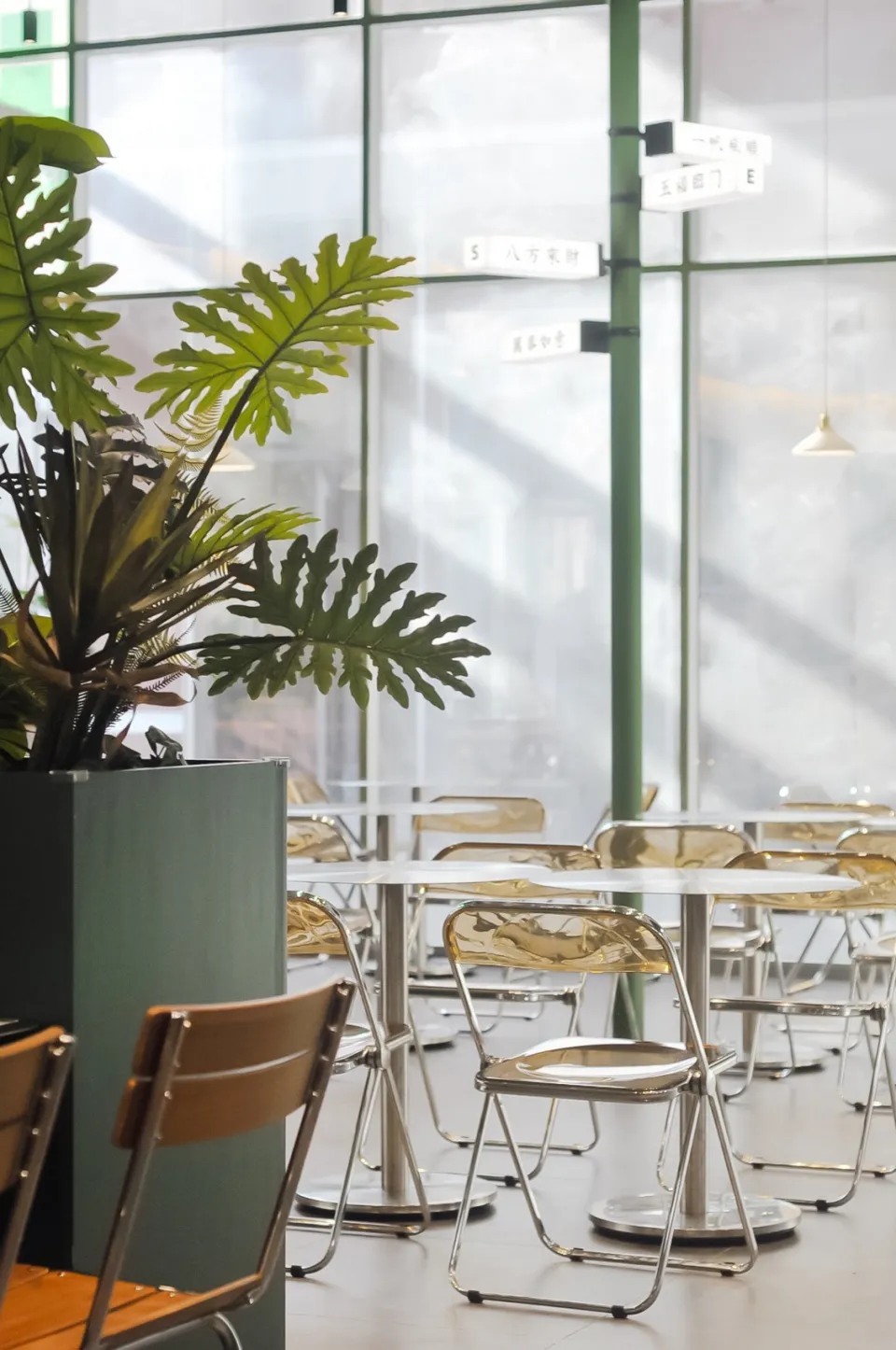 Modern cafe interior with metal and glass furniture and decor