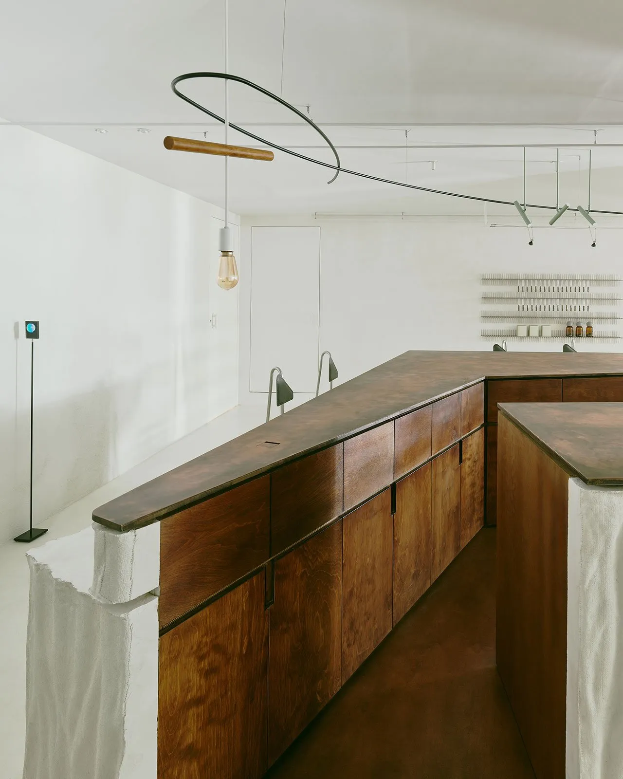 Modern commercial interior with wooden counter and minimalist design