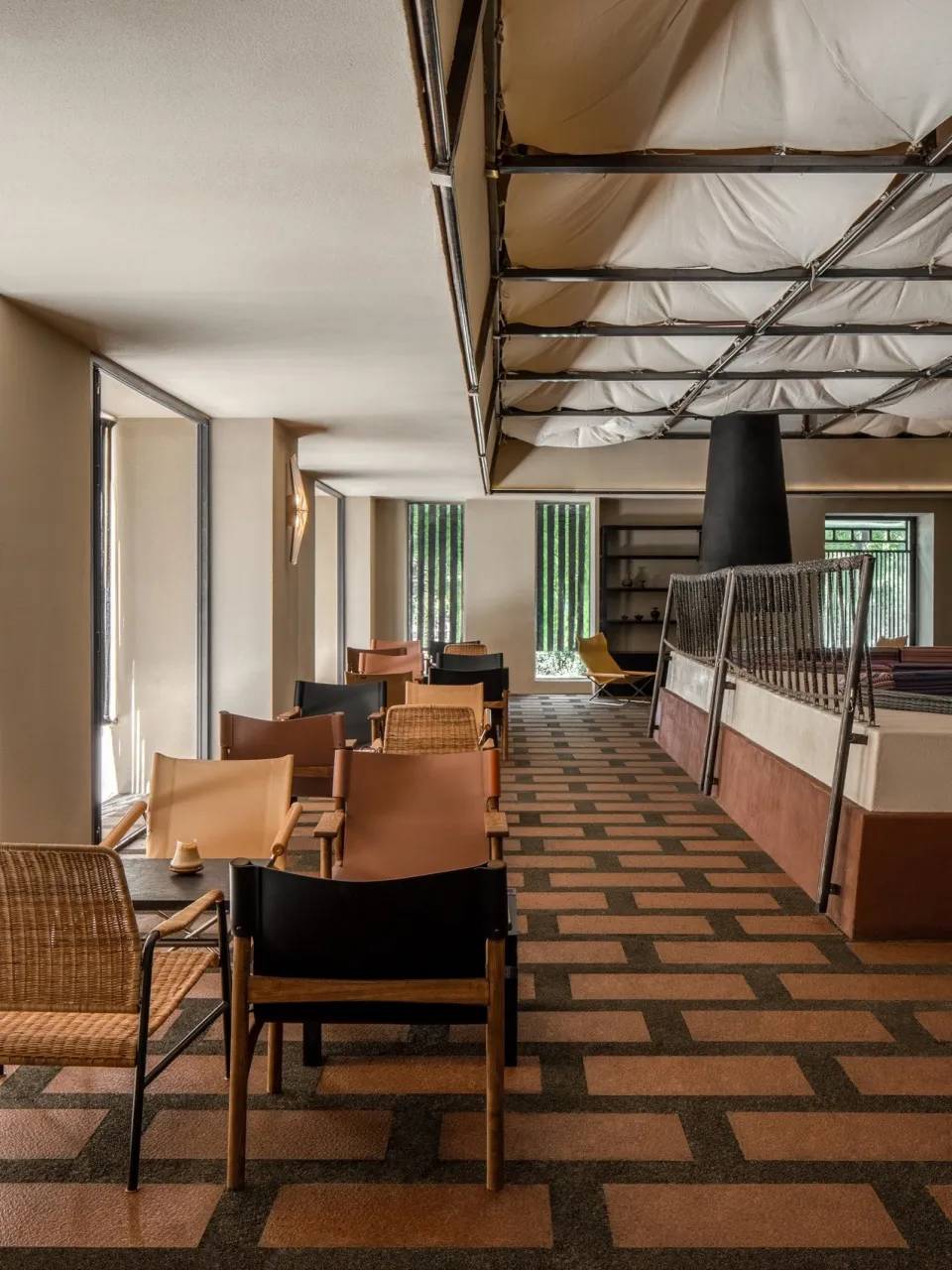 Restaurant interior with wooden laminate flooring, chairs, and tables.