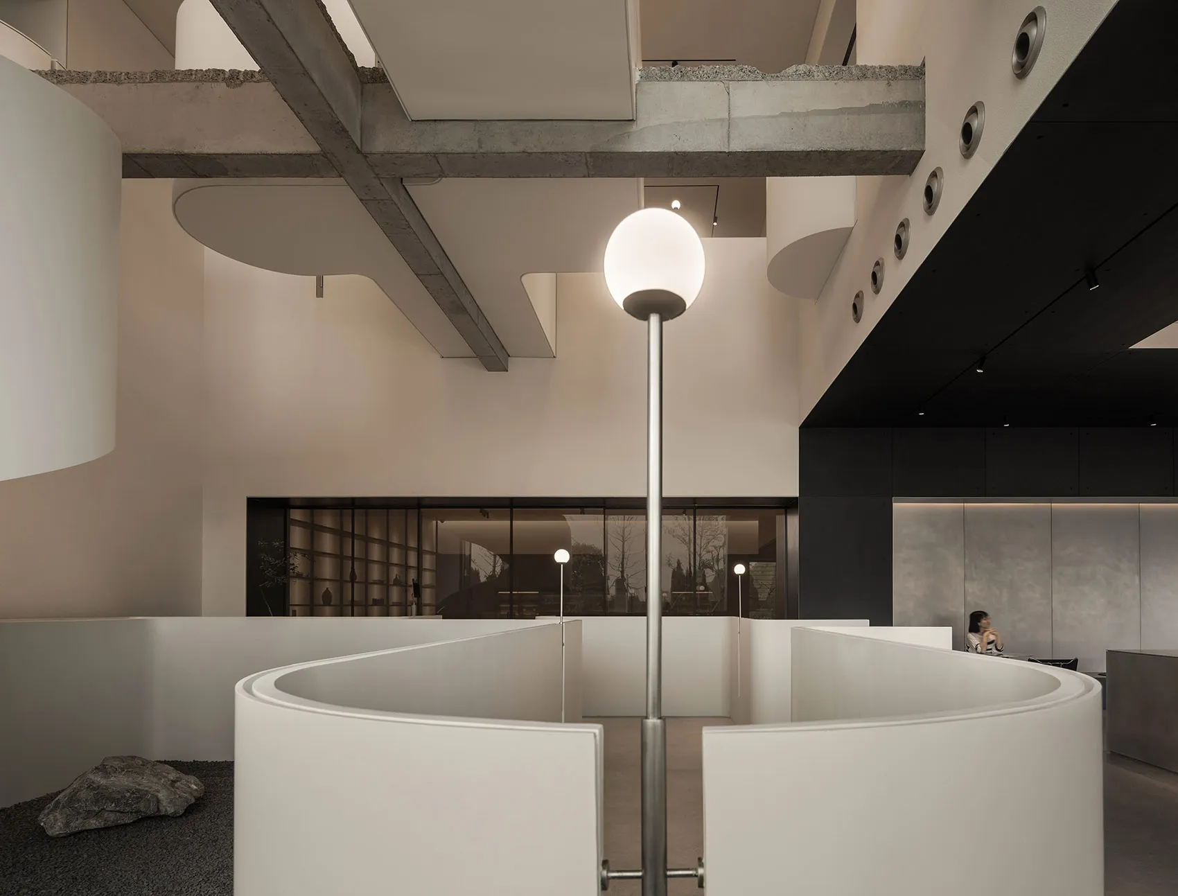 Modern office space featuring concrete walls and open layout