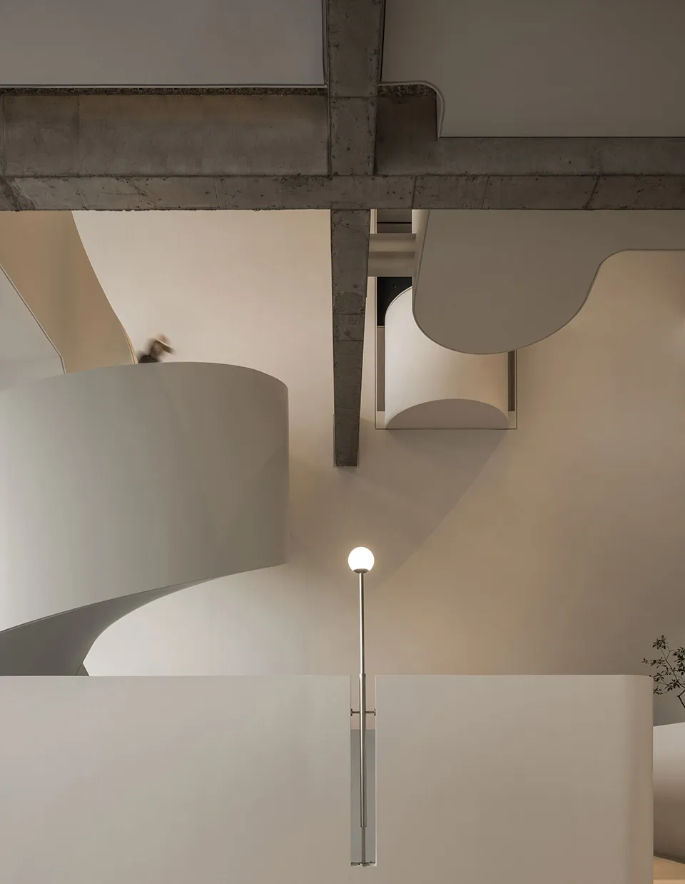 Contemporary residential interior with modern design, featuring concrete and metal materials and minimalist architectural ele