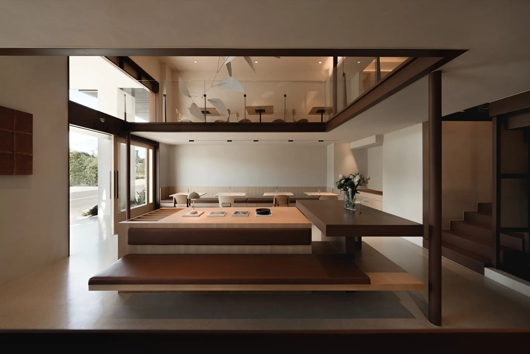 A modern restaurant interior with a wooden dining area and seating.