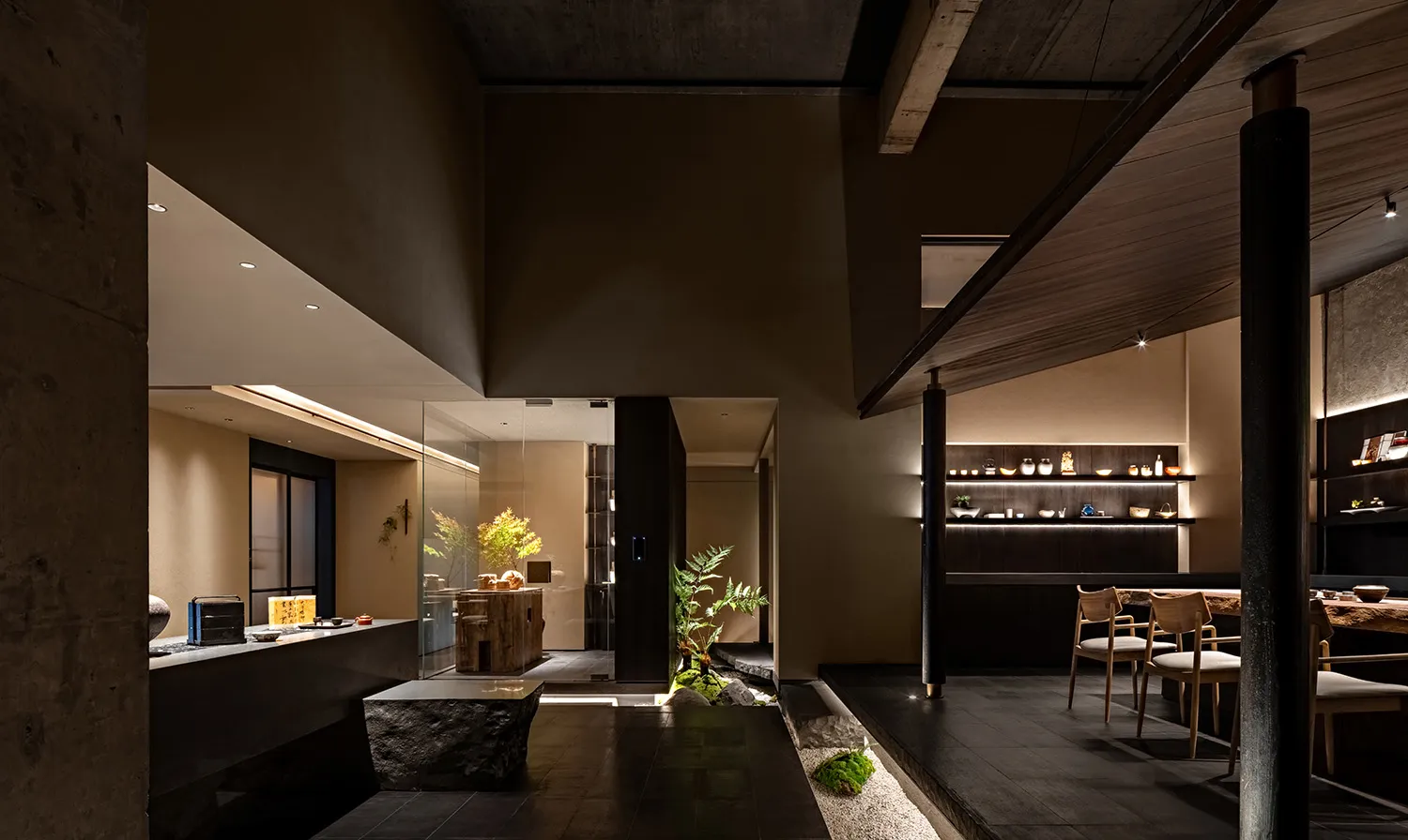 Modern restaurant interior with dark wood and concrete materials.