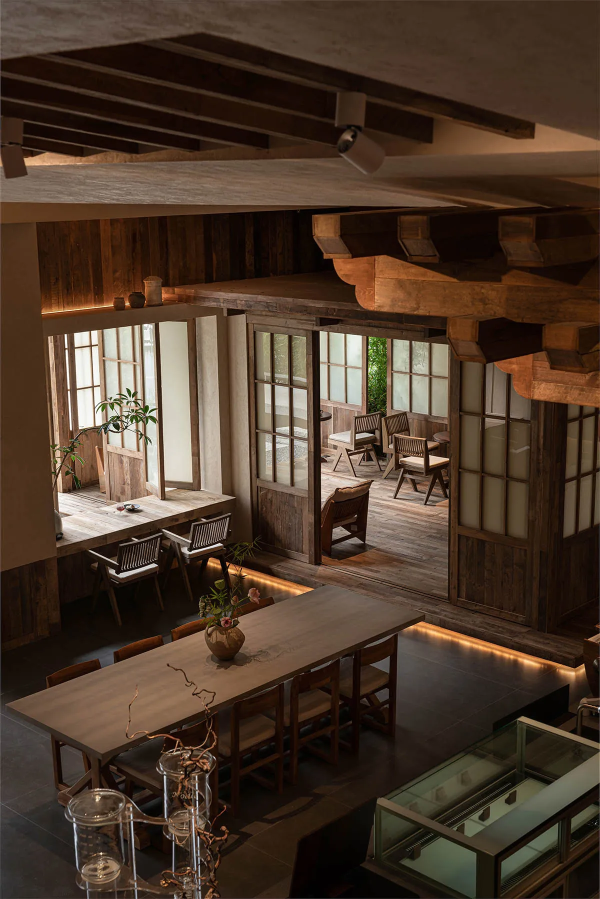A cozy rustic cafe interior with wooden furniture and a warm, inviting atmosphere.