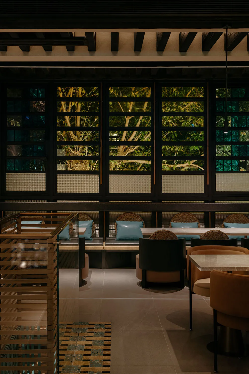 A modern restaurant interior featuring wood and leather materials.