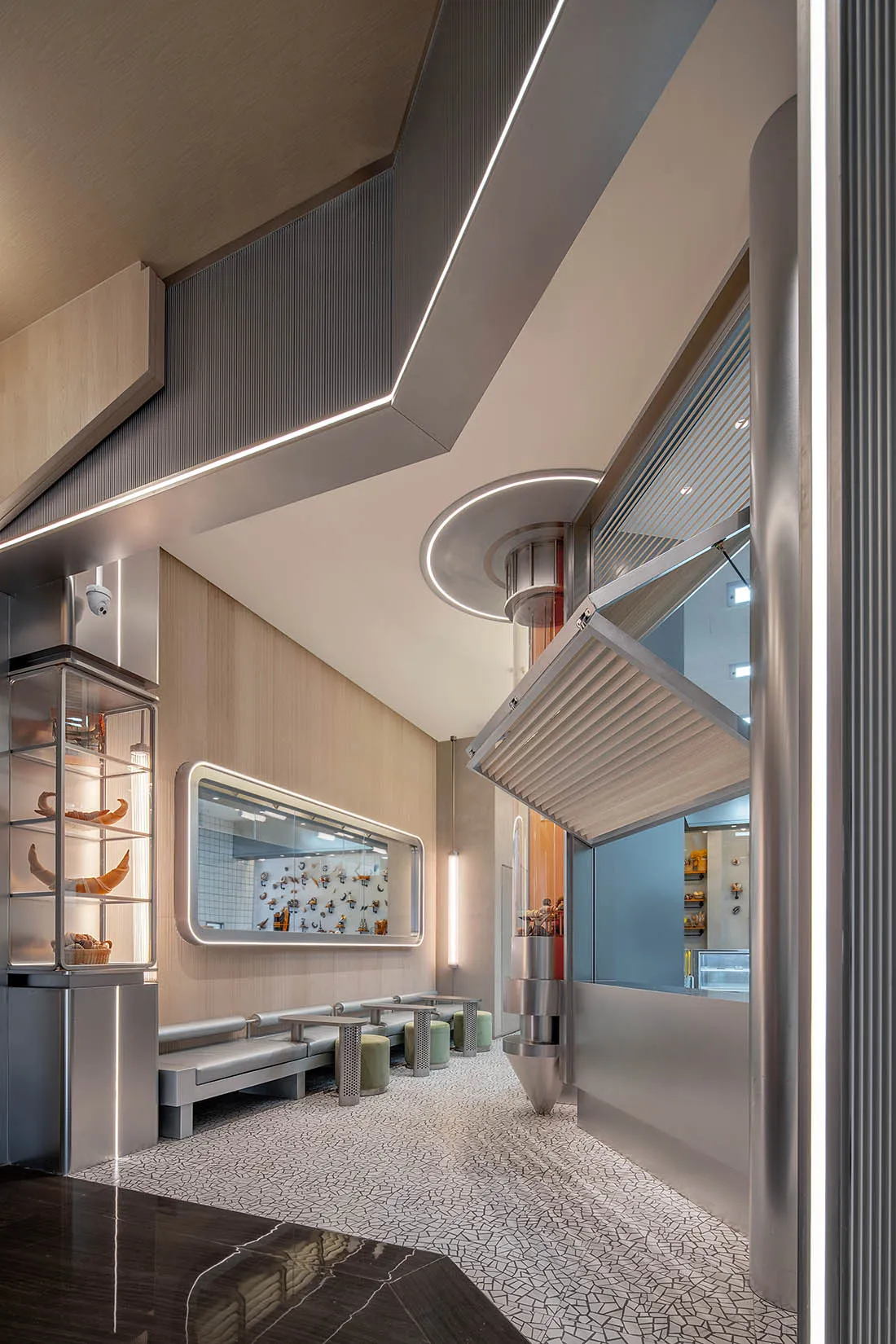 Modern, minimalist cafe interior with metallic and glass elements